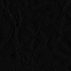 Fototapeta premium Black vintage and old looking crumpled paper background. Retro cardboard texture. Grunge paper for drawing. Ancient book page. Present wrapping.