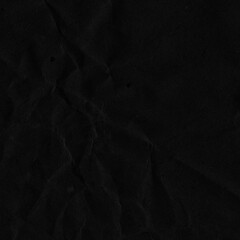 Black vintage and old looking crumpled paper background. Retro cardboard texture. Grunge paper for drawing. Ancient book page. Present wrapping.