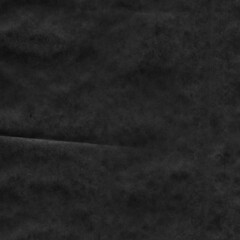 Black vintage and old looking crumpled paper background. Retro cardboard texture. Grunge paper for drawing. Ancient book page. Present wrapping.
