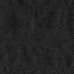 Black vintage and old looking crumpled paper background. Retro cardboard texture. Grunge paper for drawing. Ancient book page. Present wrapping.