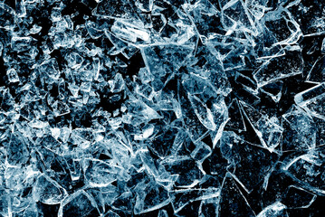Blue broken glass background. Shards of glass in blue.