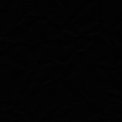Black vintage and old looking crumpled paper background. Retro cardboard texture. Grunge paper for drawing. Ancient book page. Present wrapping.