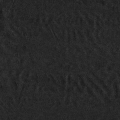 Black vintage and old looking crumpled paper background. Retro cardboard texture. Grunge paper for drawing. Ancient book page. Present wrapping.