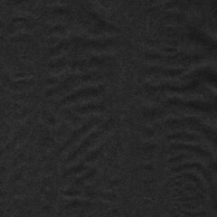 Black vintage and old looking crumpled paper background. Retro cardboard texture. Grunge paper for drawing. Ancient book page. Present wrapping.