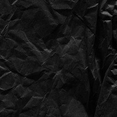 Black vintage and old looking crumpled paper background. Retro cardboard texture. Grunge paper for drawing. Ancient book page. Present wrapping.