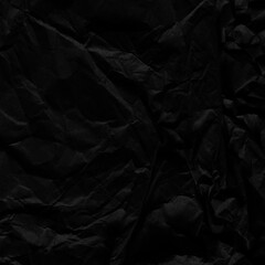Black vintage and old looking crumpled paper background. Retro cardboard texture. Grunge paper for drawing. Ancient book page. Present wrapping.