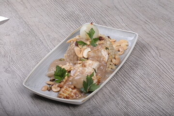 Fish fillet With the grains Dough sauce And chickpeas Decorated With green parsley And cooked onions