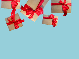 Gift boxes with red ribbon, copy space on a light blue background. Sales concepts, discount price, Christmas gifts and shopping, Greeting card for Christmas, Valentine's Day or New Year