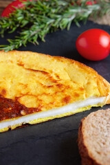 Healthy breakfast - rustic omelette with whole wheat bread and fresh tomato cherry