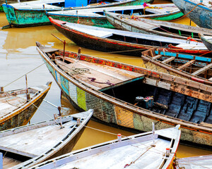 Fototapeta na wymiar Colorful wooden boats on the Ganges River in Varanasi, India