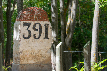 Old milestones exposed on the Bailen-Motril road (N-323) as it passes through La Cerradura de Pegalajar (Jaen-Spain)