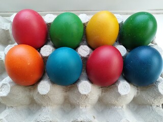 multicoloured Easter eggs in tray