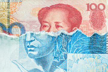 banknote of 100 reais from brazil, torn, revealing a hundred yuan note underneath. Concept of crisis between Brazil and China, low real and appreciation of the Chinese currency