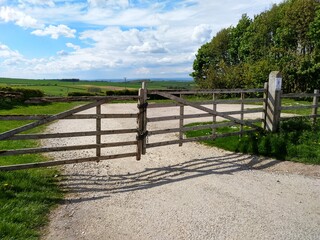 locked wooden gate on gravel car park outdoor