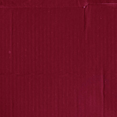 A red vintage rough sheet of carton. Recycled environmentally friendly cardboard paper texture. Simple and bright minimalist papercraft background.