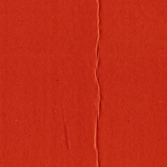 Fototapeta premium A red vintage rough sheet of carton. Recycled environmentally friendly cardboard paper texture. Simple and bright minimalist papercraft background. 
