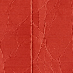 A red vintage rough sheet of carton. Recycled environmentally friendly cardboard paper texture. Simple and bright minimalist papercraft background.
