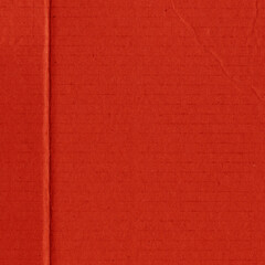 A red vintage rough sheet of carton. Recycled environmentally friendly cardboard paper texture. Simple and bright minimalist papercraft background.
