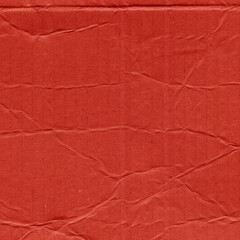 A red vintage rough sheet of carton. Recycled environmentally friendly cardboard paper texture. Simple and bright minimalist papercraft background.