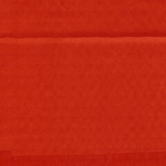 A red vintage rough sheet of carton. Recycled environmentally friendly cardboard paper texture. Simple and bright minimalist papercraft background.