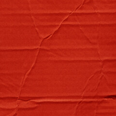 A red vintage rough sheet of carton. Recycled environmentally friendly cardboard paper texture. Simple and bright minimalist papercraft background.