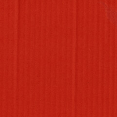 A red vintage rough sheet of carton. Recycled environmentally friendly cardboard paper texture. Simple and bright minimalist papercraft background.