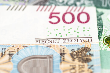 Macro photo of the front side of a rare Polish PLN 500 banknote, close-up on the inscriptions.