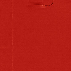 Fototapeta premium A red vintage rough sheet of carton. Recycled environmentally friendly cardboard paper texture. Simple and bright minimalist papercraft background.