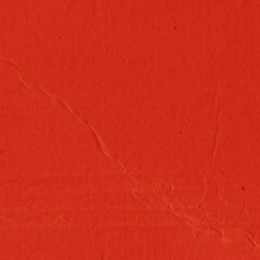 Fototapeta premium A red vintage rough sheet of carton. Recycled environmentally friendly cardboard paper texture. Simple and bright minimalist papercraft background.