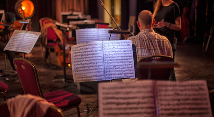 symphony orchestra musicians rehearse before the concert.