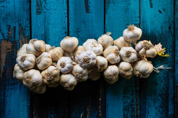 garlic bunch on a blue wooden table