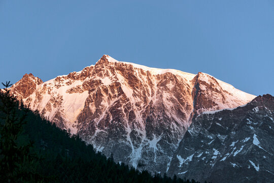 Sunrise on monte rosa and its glaciers, seen from the town of Macugnaga, Italy - July 2020.
