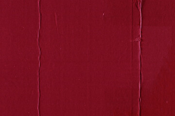 Fototapeta premium A red vintage rough sheet of carton. Recycled environmentally friendly cardboard paper texture. Simple and bright minimalist papercraft background.