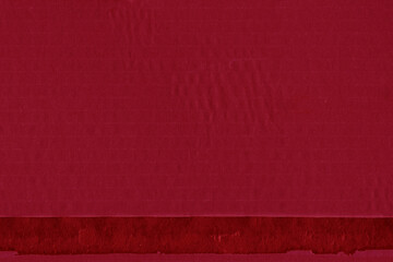 A red vintage rough sheet of carton. Recycled environmentally friendly cardboard paper texture. Simple and bright minimalist papercraft background.