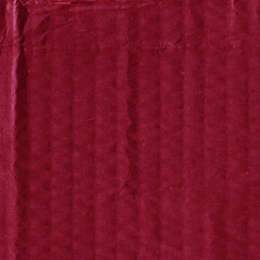 A red vintage rough sheet of carton. Recycled environmentally friendly cardboard paper texture. Simple and bright minimalist papercraft background.