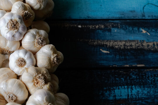 garlic bunch on a blue wooden table