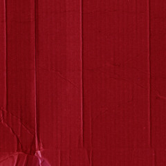 Fototapeta premium A red vintage rough sheet of carton. Recycled environmentally friendly cardboard paper texture. Simple and bright minimalist papercraft background.