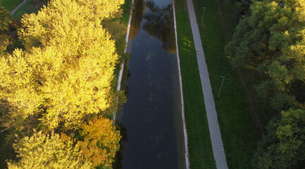Top view of a beautiful green park with a river