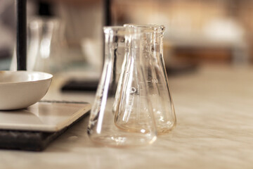 experiment beaker in chemistry science laboratory background, medical concept