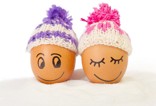 funny lovely eggs in winter hats and sugar like a snow