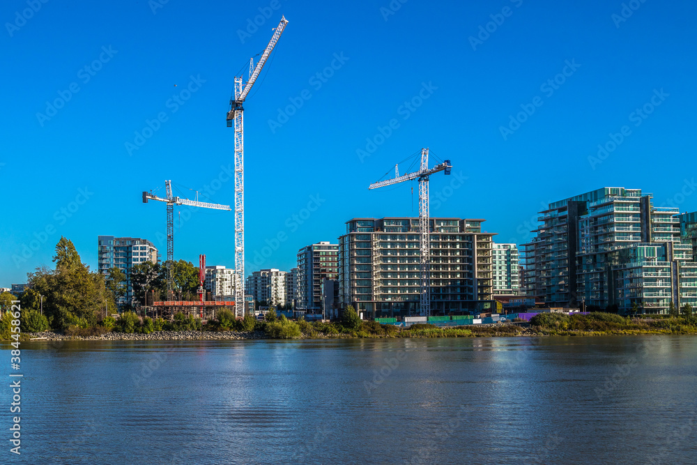 Wall mural Construction of a new residential area on the banks of the Fraser River in Richmond City, Canada