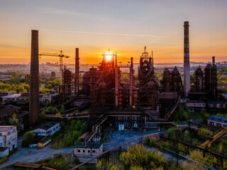 Blast furnace equipment of the metallurgical plant at the sunset, aerial view