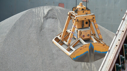 Loading and dischargind operation of bulk cargo bauxite on bulk carrier ship using grab bucket or...