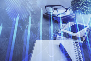 Double exposure of forex chart drawing and cell phone background. Concept of financial trading