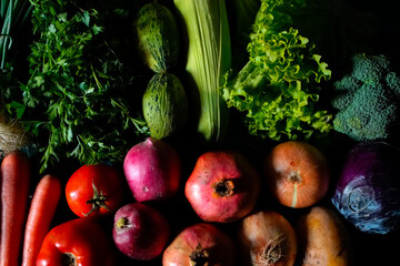 red and green fresh vegetables fruits on blue wood