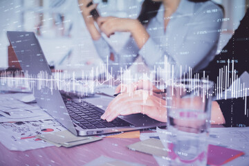 Multi exposure of woman hands typing on computer and forex chart hologram drawing. Stock market analysis concept.