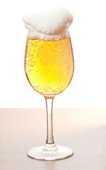 Glass of cold beer over wooden surface