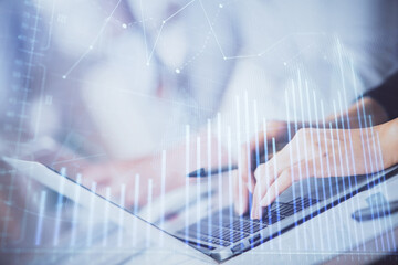 Double exposure of woman hands typing on computer and forex chart hologram drawing. Stock market invest concept.