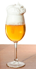 Glass of cold beer over wooden surface