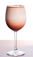 Chocolate milk on a wooden table.